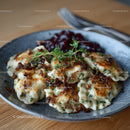 Delicious Fried Potstickers with Soy-Glazed Onion Garnish in a Rustic Bowl