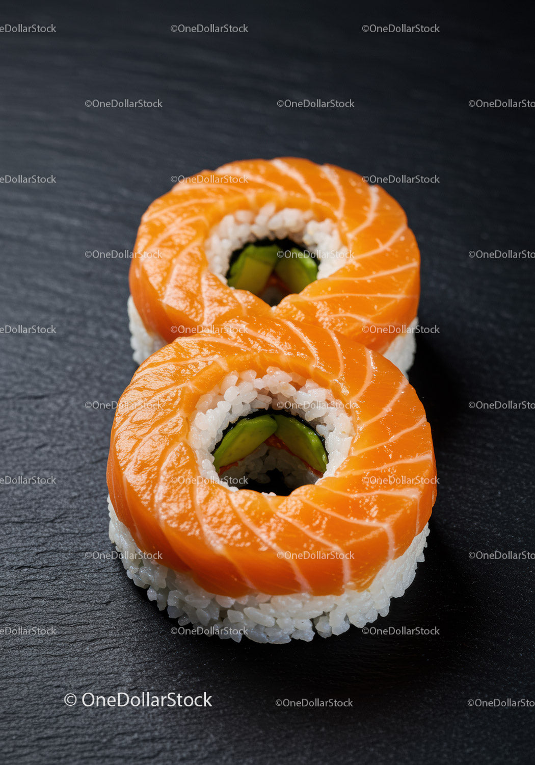 Fresh Salmon Sushi Rolls on Black Slate Plate
