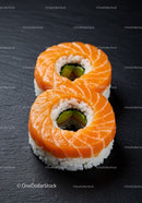 Fresh Salmon Sushi Rolls on Black Slate Plate