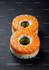 Fresh Salmon Sushi Rolls on Black Slate Plate