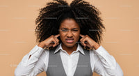 Frustrated Woman Covering Ears with Annoyed Expression