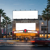 Historic theater facade with illuminated marquee at dusk