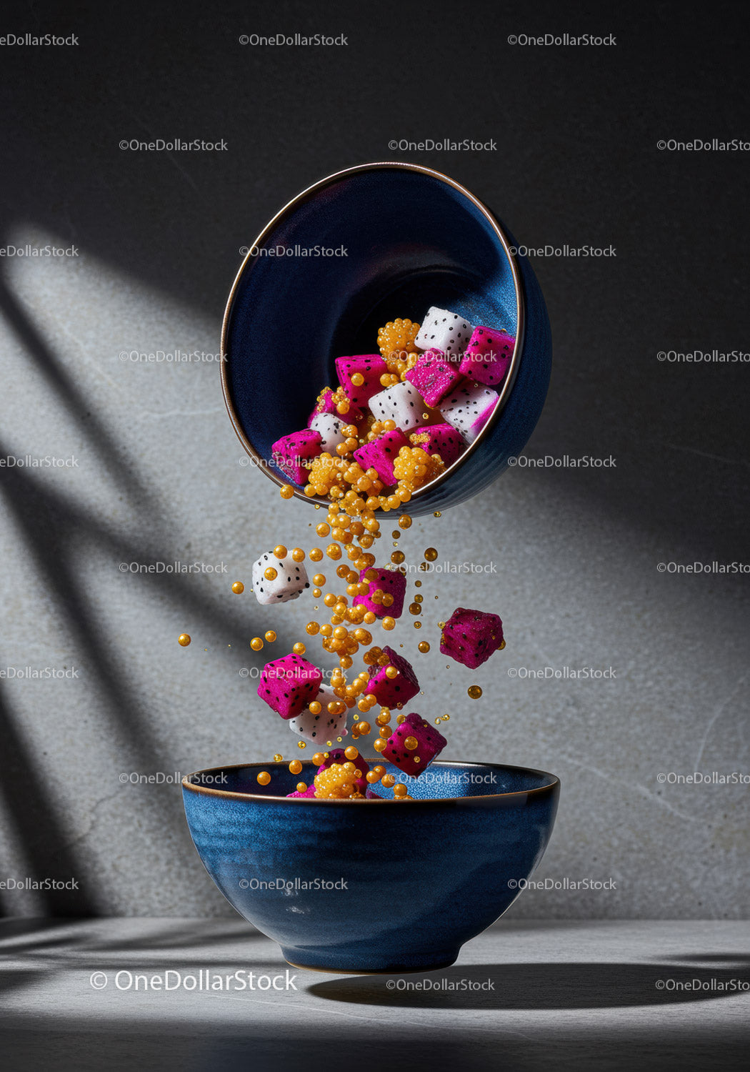 Colorful dragon fruit cubes falling into navy bowl
