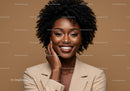 Confident Smiling Woman with Natural Hair in Beige Blazer