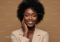 Confident Smiling Woman with Natural Hair in Beige Blazer