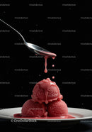 Three scoops of raspberry sorbet with syrup drip