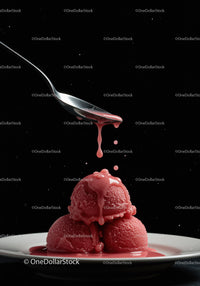 Three scoops of raspberry sorbet with syrup drip