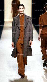 Model walking runway in autumn wool coat and tailored pants