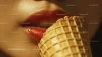 Close-up of Red Lips and Waffle Cone with Vanilla Ice Cream