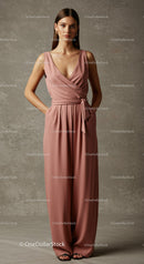 Elegant woman in dusty rose sleeveless jumpsuit