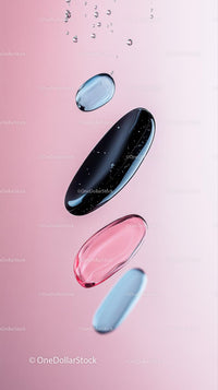 Close-up of Floating Pills with Water Droplets in Soft Pink Background