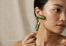 Woman Using Jade Roller for Facial Skin Rejuvenation and Glow