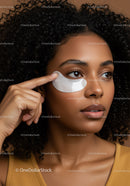 Young Woman Applying Under Eye Patch for Skincare Routine