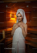 Relaxing Woman in Towel Relaxing in Sauna Room with Wooden Interior