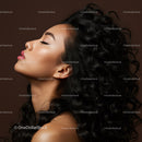 Profile of young woman with curly hair and glowing skin