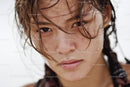 Close-up of a Young Woman with Wet Hair and Expressive Gaze