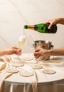 Celebratory Champagne Pour in Elegant Setting with Glasses and Coasters
