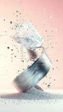 Falling Silver Cylinder with Glitter Explosion in Modern Abstract Scene