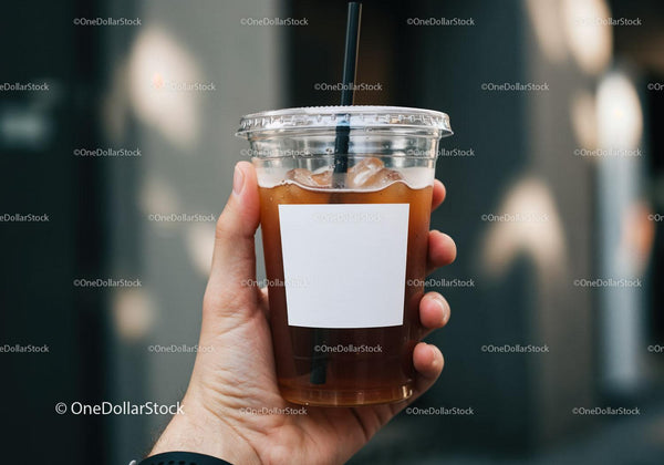 Hand Holding Iced Coffee in Plastic Cup with Straw JPG Mockup Image