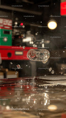 Melting Ice Cube Exploding Into Water Splash in Urban Setting