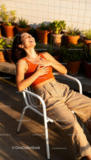 Young woman enjoying sunlight with joyful laughter