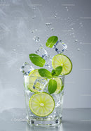 Refreshing lime and mint drink with ice splashing