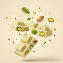 Chunks of white chocolate with whole pistachios floating