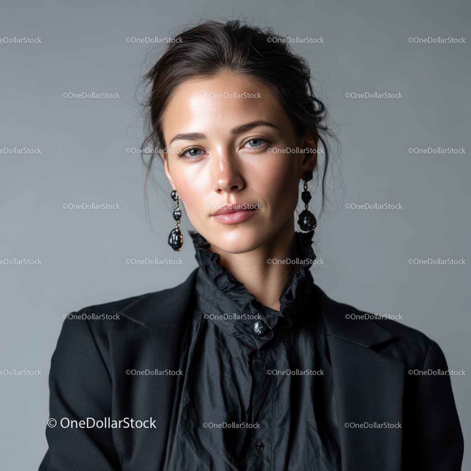 Elegancka modelka w czarnej, modnej marynarce z efektownymi kolczykami