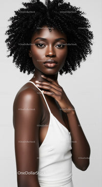 Striking African American Woman with Curly Hair in Minimalist Studio Portrait