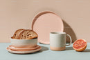 Stylish Breakfast Plate with Whole Grain Bread and Fresh Grapefruit