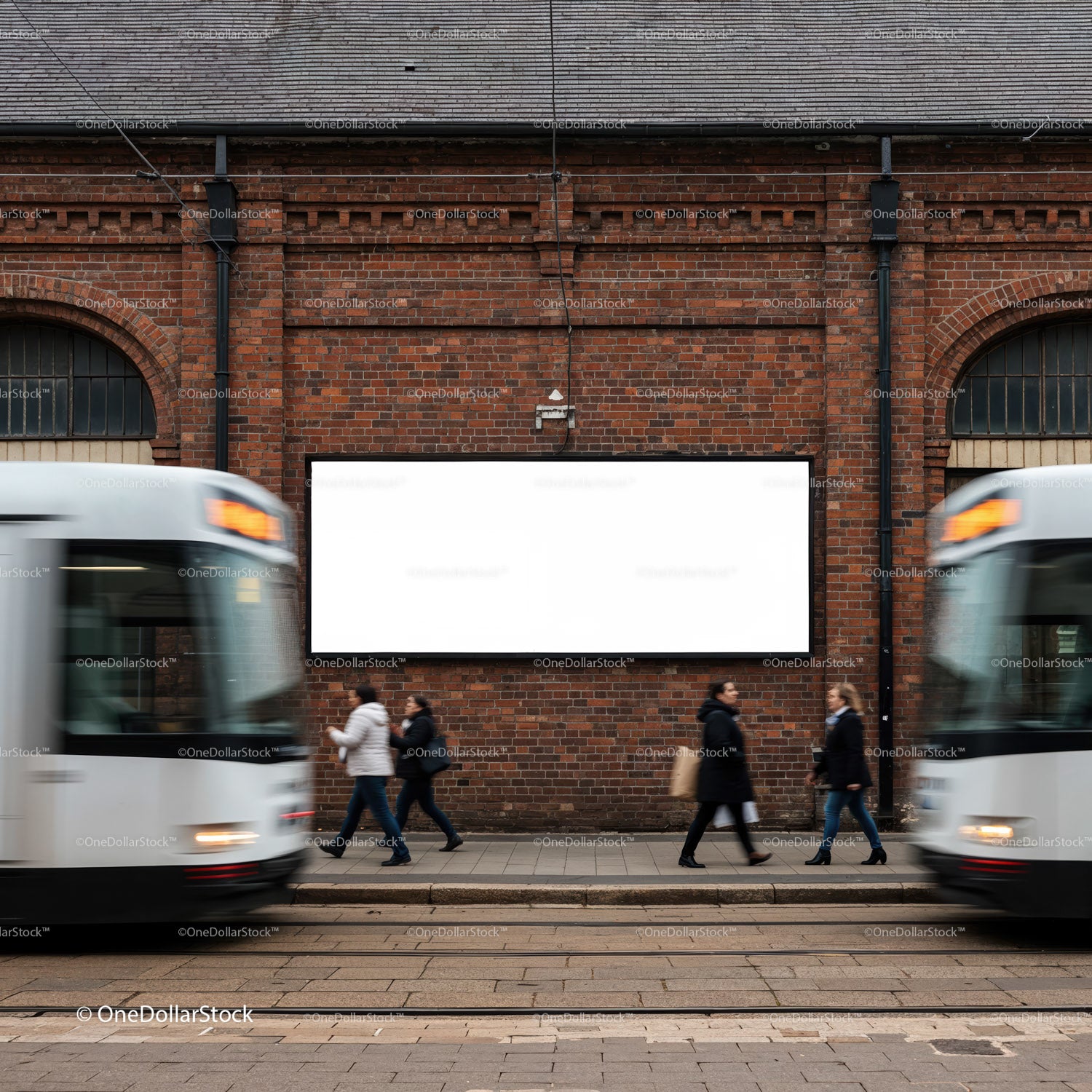 Busy city street with pedestrians and blank billboard