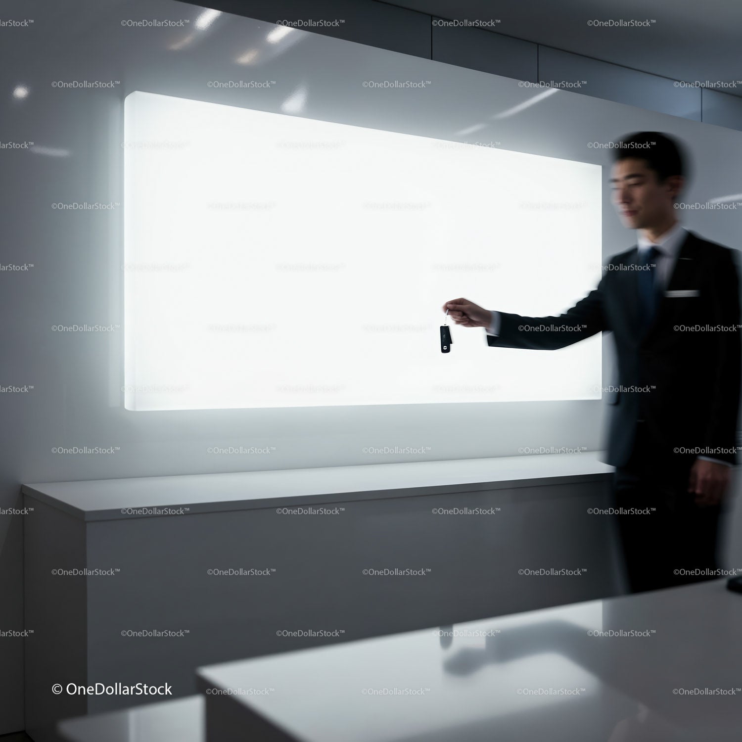 Businessman Holding Car Key in Modern Minimalist Space