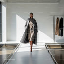 Woman walking confidently in winter fashion outfit
