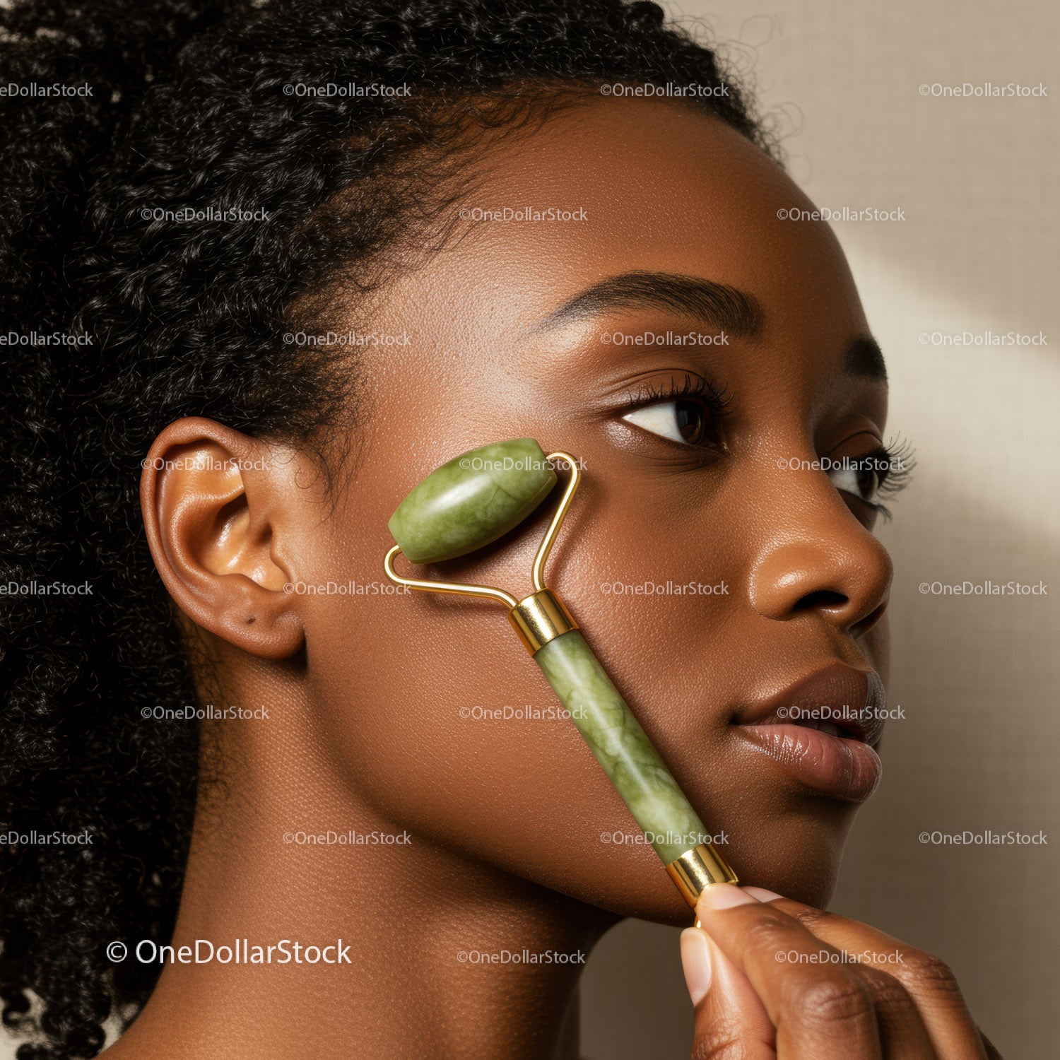 Young Woman Using Jade Roller for Facial Skin Rejuvenation