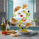 Mediterranean ingredients with olive oil splash in kitchen