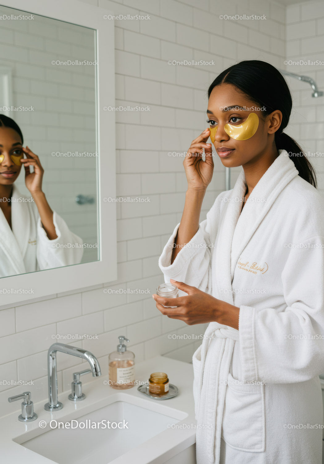 Elegant Woman Applying Serum with Skincare Products in Modern Bathroom