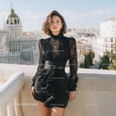 Elegant Woman Wearing Black Dress with Cityscape Background