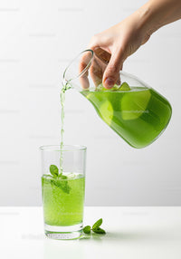 Refreshing Green Mint Drink Being Poured Into Glass