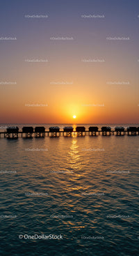 Beautiful Sunset Over Tropical Ocean with Overwater Bungalows