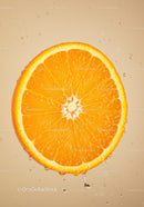 Fresh orange slice dripping with juice on beige background