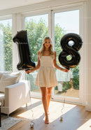 Young woman celebrating 18th birthday indoors