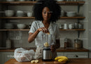 Woman Preparing Banana Smoothie in Modern Kitchen for Healthy Lifestyle