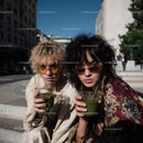 Stylish Women with Green Cocktails in Urban City Scene