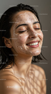 Young Woman Smiling with Facial Cleansing and Relaxation