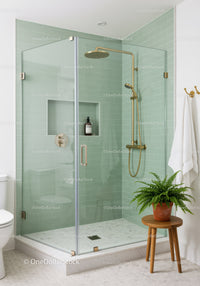 Modern glass shower enclosure with brass fixtures