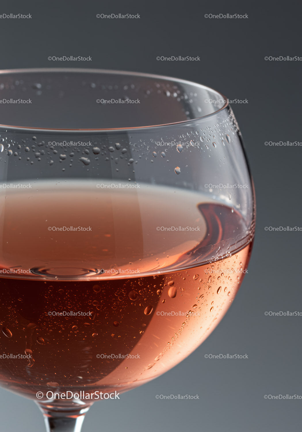 Close up of a glass with sparkling rosé wine