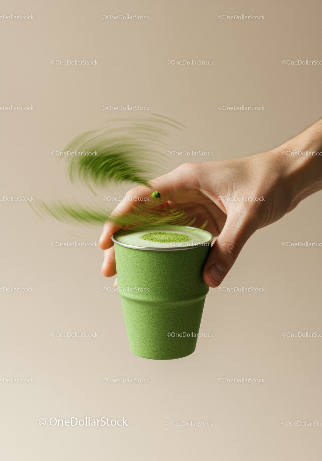 Hand Sprinkling Matcha Powder Over Green Cup Drink