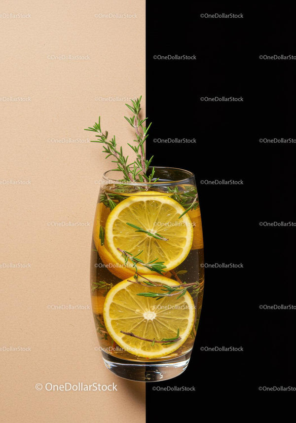 Refreshing lemon and rosemary infused water in glass