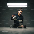 Barista preparing pour over coffee in minimalistic setting