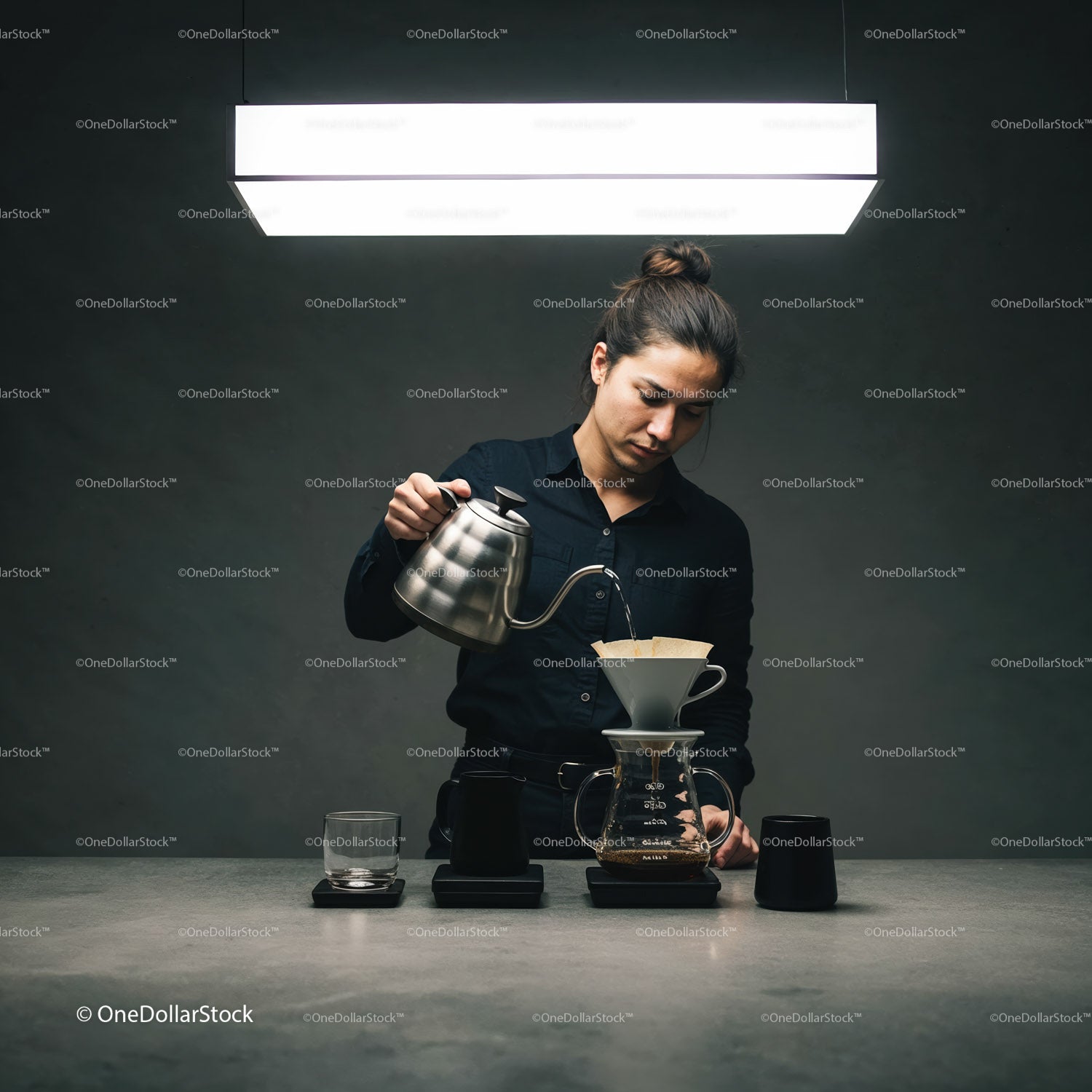Barista preparing pour over coffee in minimalistic setting